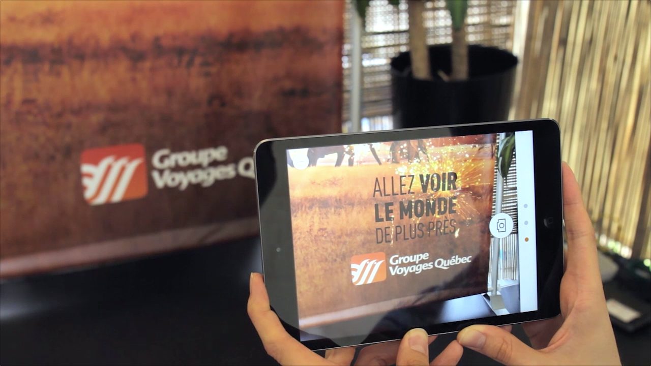 Groupe Voyages Québec AR app on a tablet